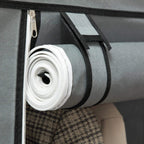 Light grey fabric wardrobe cover close-up of rolled zipper track and fabric tie strap.