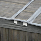 Grey fabric-lined lid with latch detail on bamboo laundry basket