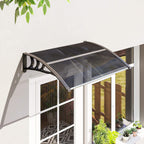 Black curved door canopy awning mounted over an entry doorway with protective shield