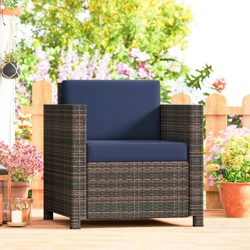 Rattan armchair with navy cushion and mixed brown woven frame, front view on patio.