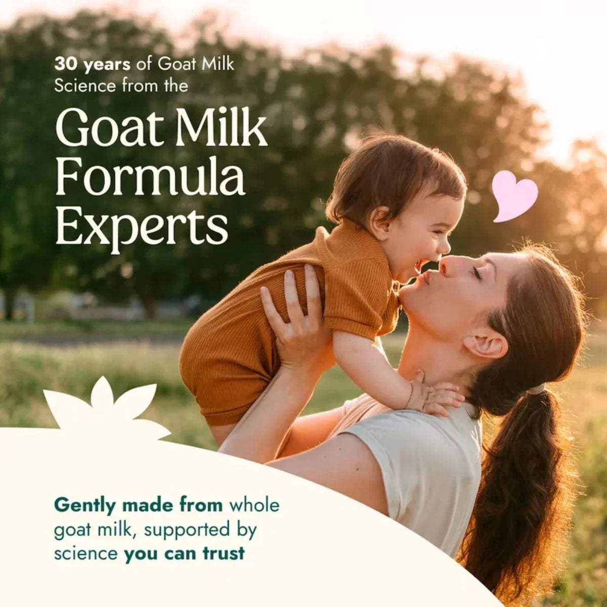 Mother and toddler cuddle with “Goat Milk Formula Experts” text over outdoor scene