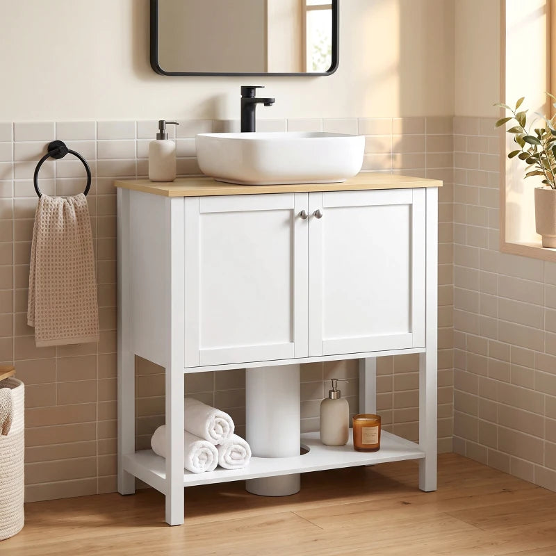 White under-sink cabinet with 2 doors and open shelf, towel and bottle storage