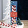 Set of 3 candy cane stripe taper candles in gift box packaging