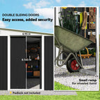 Black corrugated metal shed with double sliding doors and a small wheel ramp