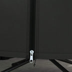 Black cover zipper close-up with cord pull at base hem