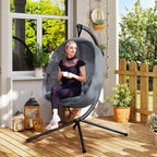 Grey hanging egg chair swing hammock with cushion and side pockets on stand