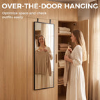 Black full-length rectangular mirror hanging over a door