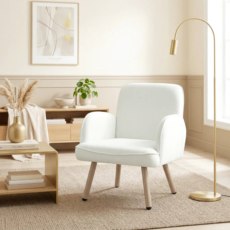 Cream velvet lounge armchair with rounded back, padded arms, and spring seat cushion
