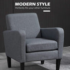 Grey upholstered accent chair with high backrest and thick seat cushion