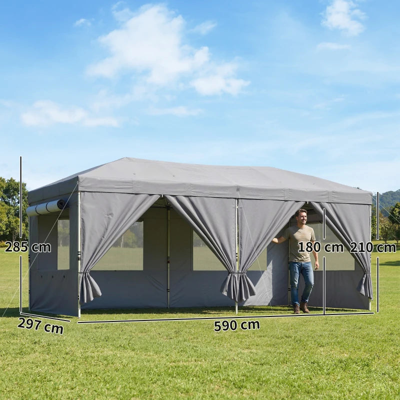 Dark grey pop-up gazebo canopy with sidewalls installed in a backyard