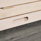 Natural wood front handle and latch slot detail on a rodent cage panel