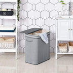 Grey foldable laundry basket with flip lid, side handles, removable inner liner.