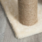 Cat tree plush base edge beside sisal scratching post