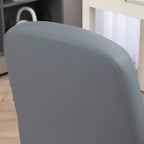 Close-up of grey padded chair back with smooth PU leather upholstery