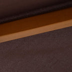 Coffee-brown canopy fabric with fine weave texture over wooden support rib