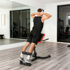 Roman chair hyperextension bench with padded back and foam foot rollers in use