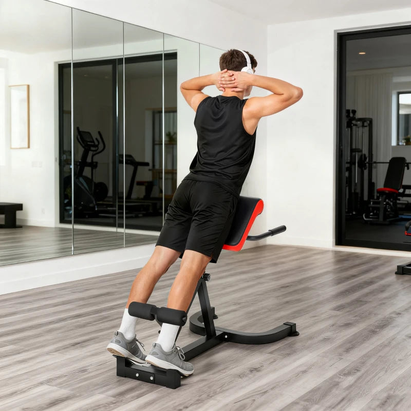 Roman chair hyperextension bench with padded back and foam foot rollers in use