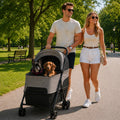 Grey pet stroller with padded top, mesh seat, and four-wheel frame for dogs