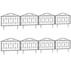 Black metal garden fence panels with ornate scrollwork and pointed stake feet