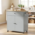 Grey rolling kitchen island with wood top, drawer, cabinet doors, and side rack on wheels