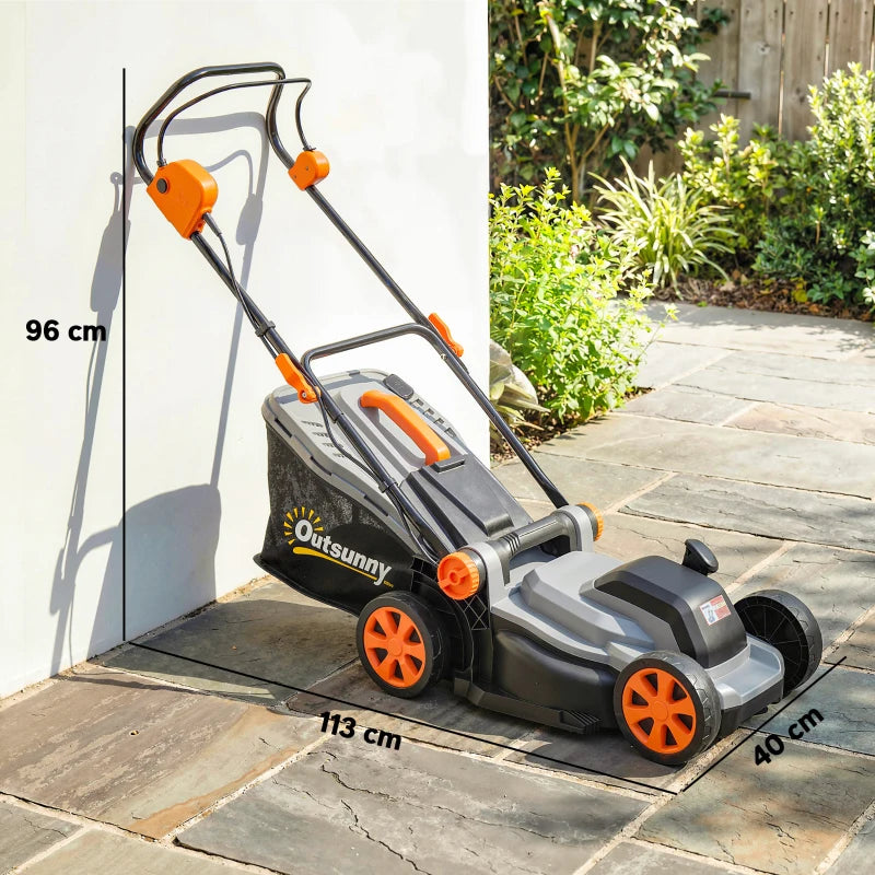 Cordless lawn mower on patio with orange grips and light grey deck, side view
