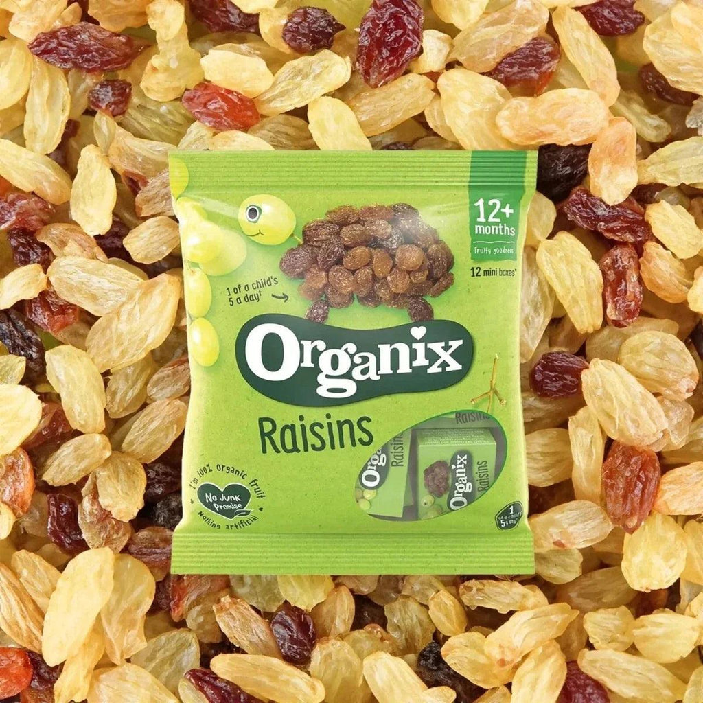 Organix Raisins snack pouch surrounded by golden and dark raisins