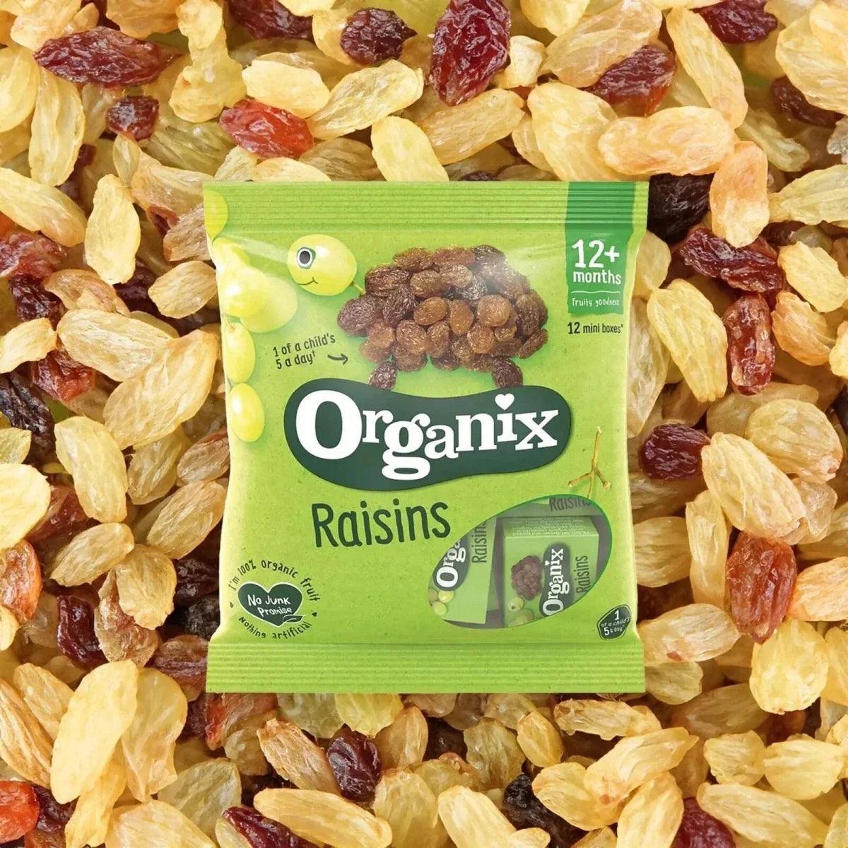 Organix Raisins snack pouch surrounded by golden and dark raisins