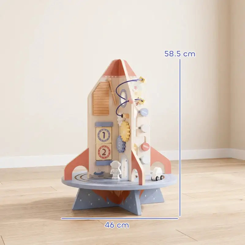 Rocket-themed wooden activity cube toy with bead maze and gears, shown with dimensions