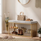 Grey upholstered shoe storage bench with gold steel frame and two-tier shoe compartments