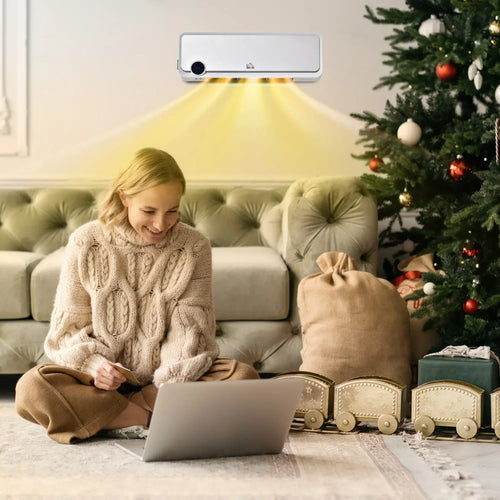 White wall-mounted electric space heater warming a living room with remote