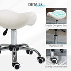 Cream saddle seat on hydraulic chrome base with 5-point legs and caster wheels