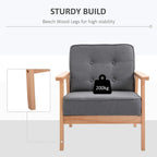 Grey linen-look accent armchair with beech wood legs, button-tufted back, and padded seat