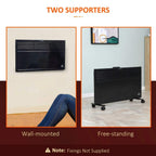 Black wall-mounted convector radiator with vented front and control indicator