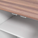 Underside view of raised tabletop with adjustable support rails on feeding station