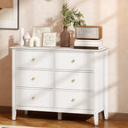 White fluted 6-drawer dresser with three rows of drawers and gold round knobs