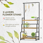 3-tier flower stand with hanging hooks, black metal frame and light wood shelves with plants
