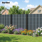 Grey privacy screen fence along a garden area with vertical panel grid