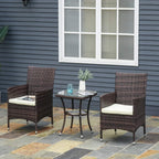 Brown rattan armchairs with white cushions and square glass-top side table