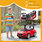 Red Mercedes-Benz ride-on car with child seated, black seat and steering wheel