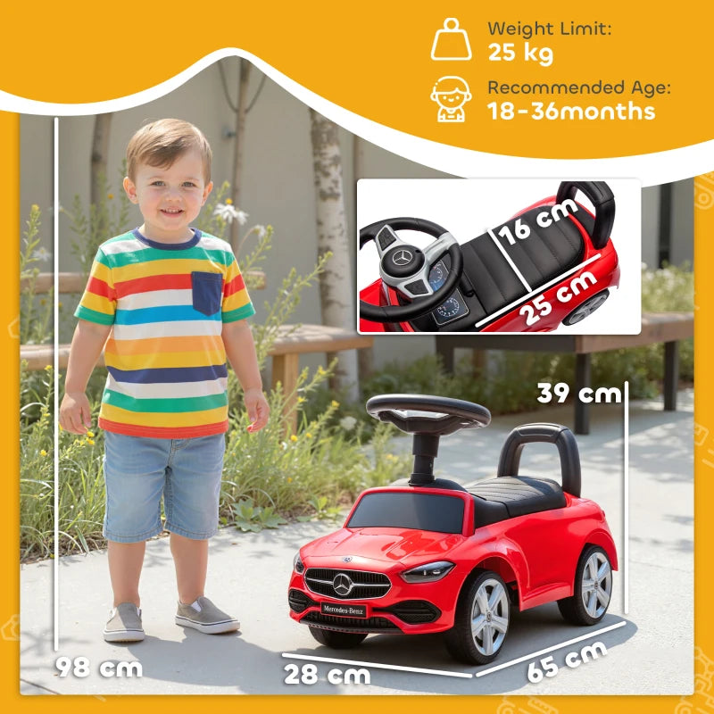 Red Mercedes-Benz ride-on car with child seated, black seat and steering wheel
