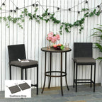 Pair of dark grey chair seat cushions with ties, shown on outdoor chairs