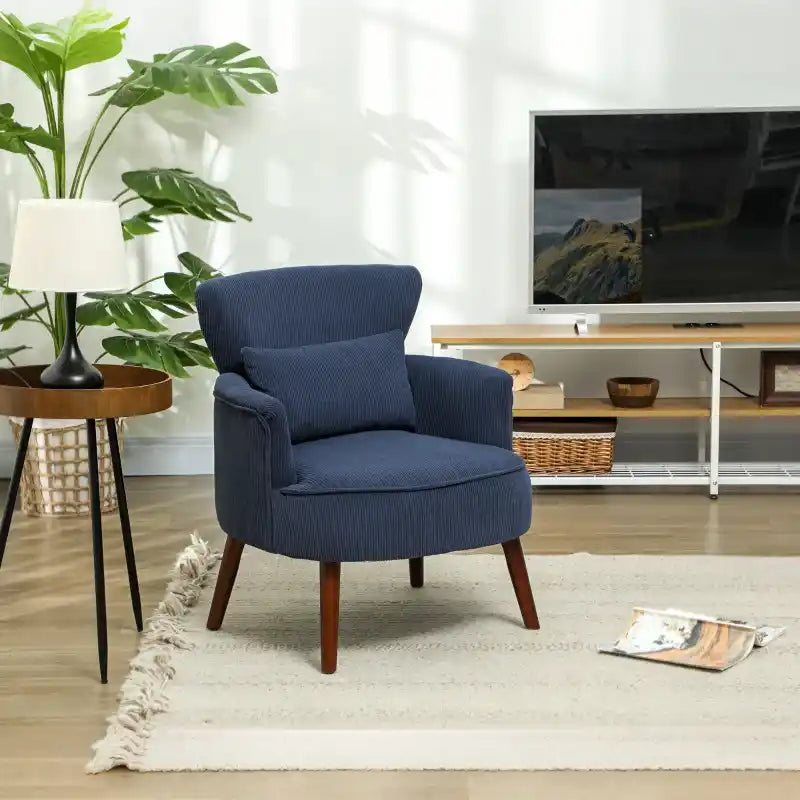 Blue corduroy accent armchair with curved arms, rounded back, and dark wood legs