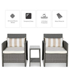 Light grey rattan armchairs with striped pillows and matching bistro side table