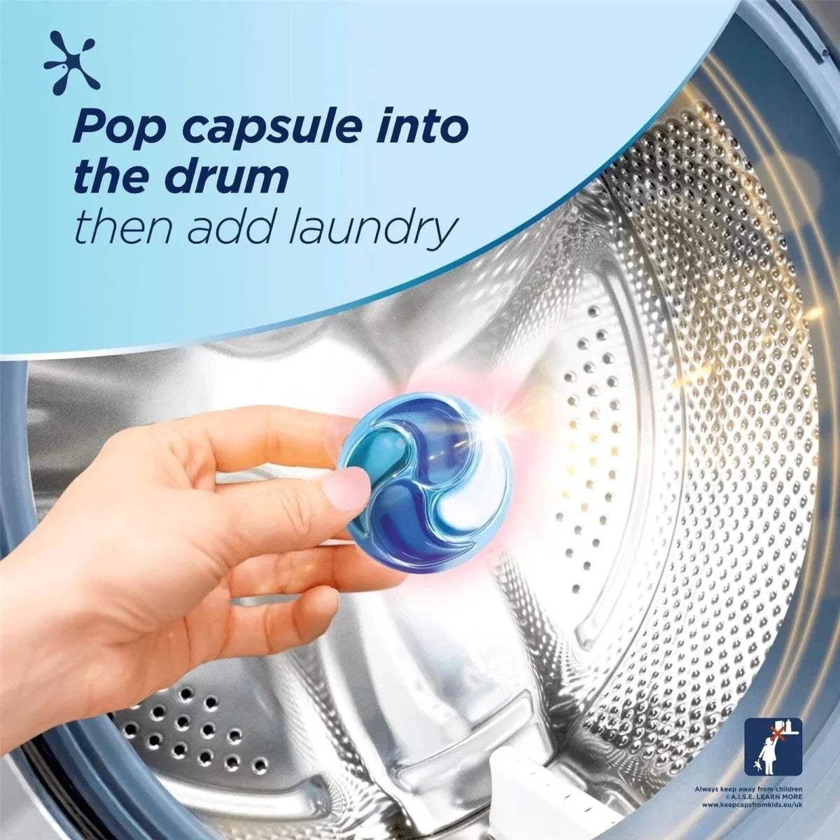 Hand placing a blue Persil Non Bio laundry capsule into washing machine drum