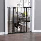 Black indoor pet gate with vertical bars, side hinges, and a small cat flap opening