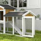 Yellow double-tier rabbit hutch with ramp, wire mesh walls and dark roof for outdoors