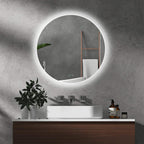 Round LED bathroom mirror with lit perimeter ring and wall-mounted round frame