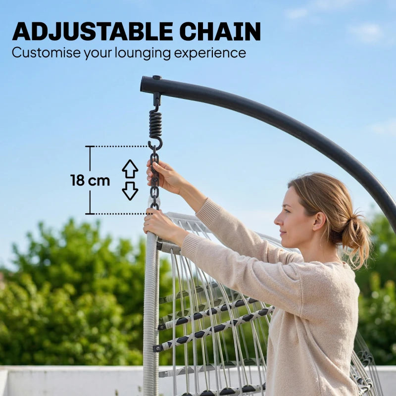 Light grey hanging egg chair with adjustable hanging chain and padded cushion