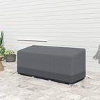 Grey patio sofa cover on outdoor floor, rectangular top and corner fastening ties