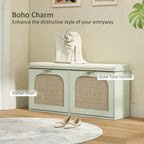 Light green entryway shoe bench with padded seat, two rattan-style doors, gold-tone handles